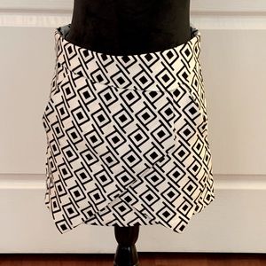 Skirt with symmetric layered hem.